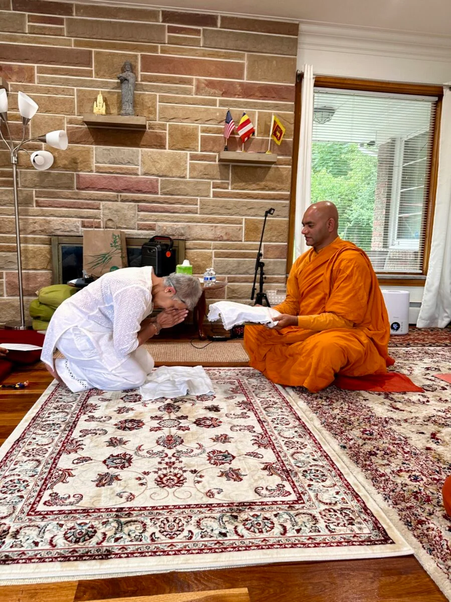 Monk and guest signing retreat extension form
